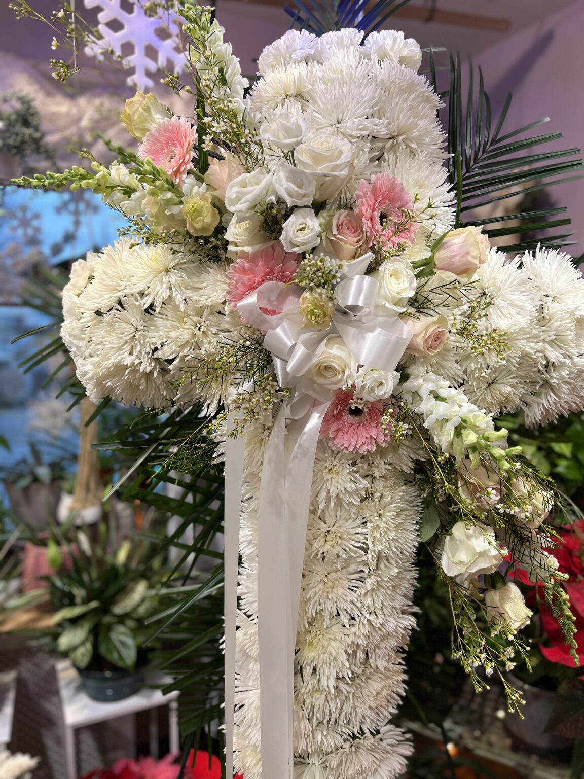 white cross with pink flowers